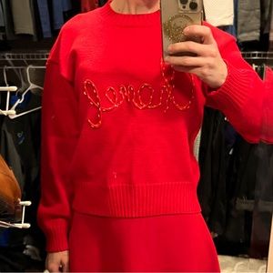 Red sweater with Chanel embroidered